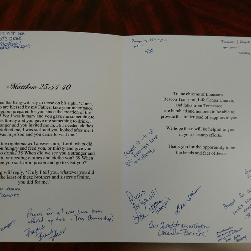 Card with signatures for Trucking Logistics during the 2016 Flood